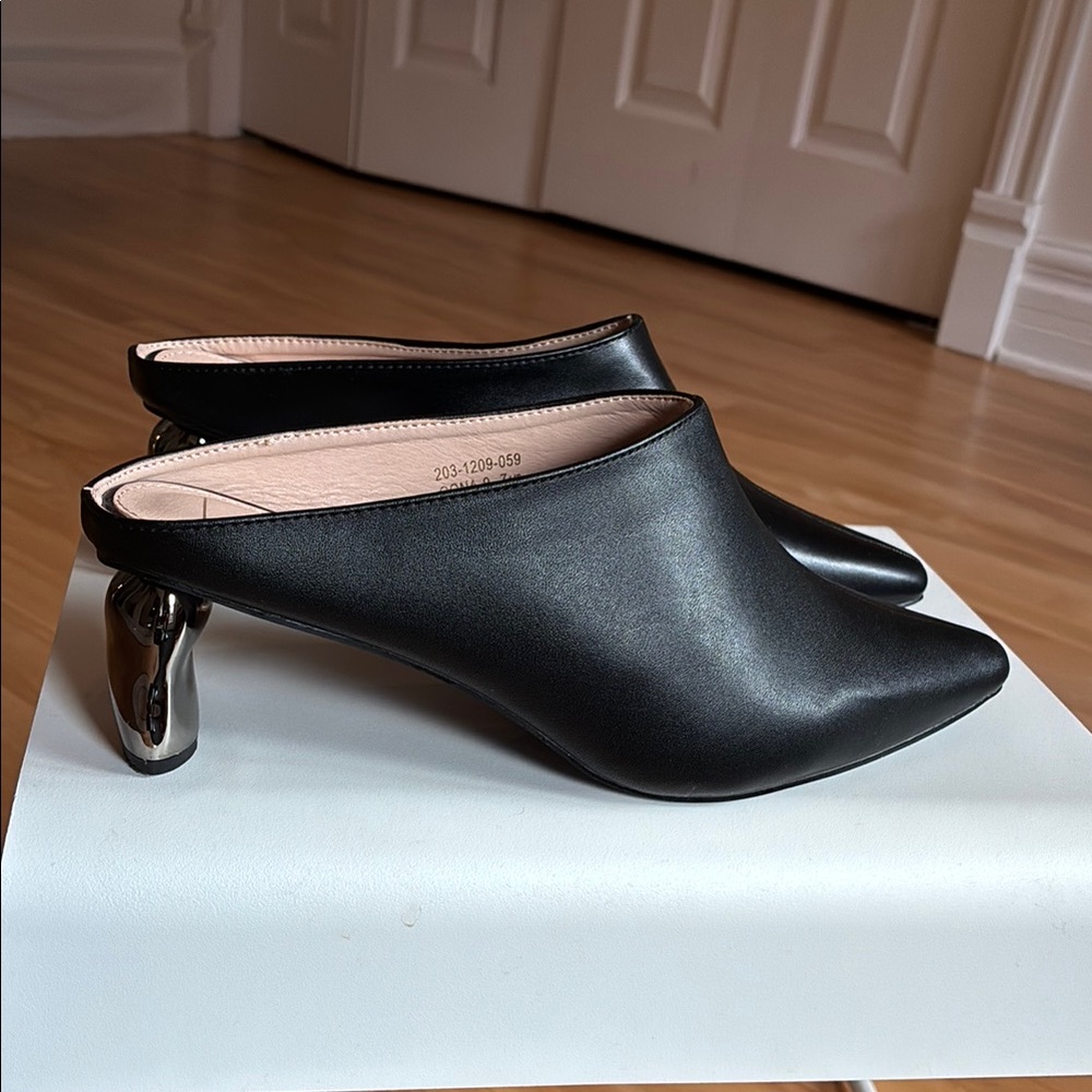 New Black Leather Mules with Silver Heel
Never worn